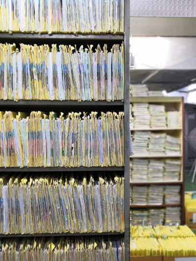 A room with files packed on bookshelves in a room