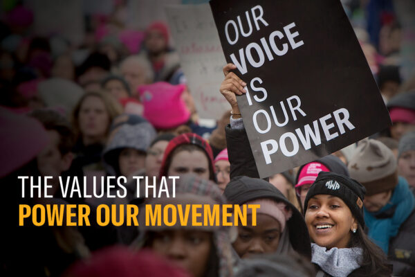 the front cover of the annual report that reads "the values that power our movement" with a protest image in the background.