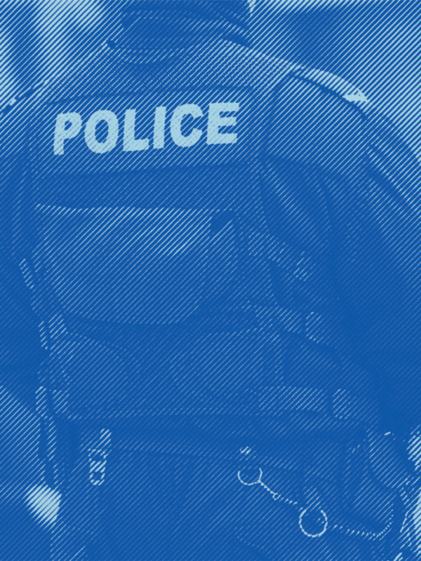 An image of the back of some where wearing a police vest and uniform with a blue stripped treatment applied.