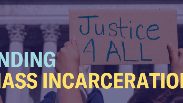 The words "Ending mass incarceration" are laid over an image of hands holding a sign that says "Justice 4 All"
