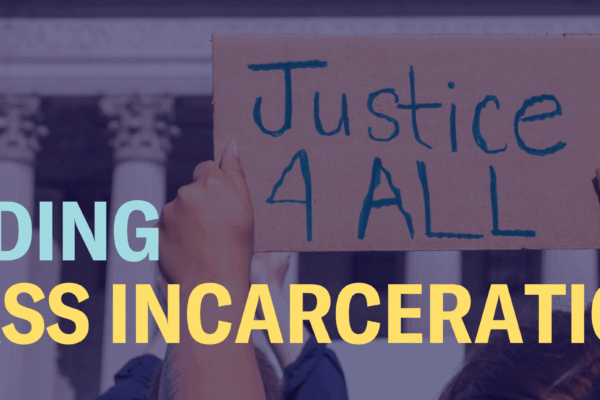The words "Ending mass incarceration" are laid over an image of hands holding a sign that says "Justice 4 All"