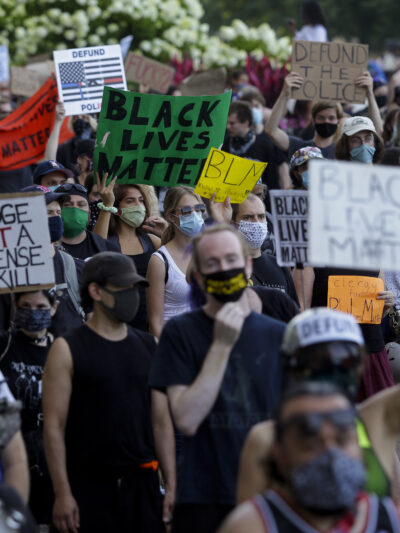 Protesters holding signs
