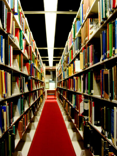 Library shelves in dark lighting