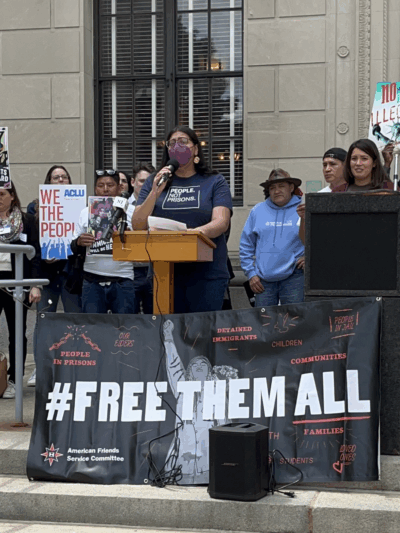 Protestors with a sign "#Freethemall" outside the NJ statehouse