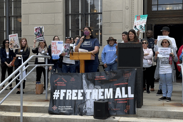 Protestors with a sign "#Freethemall" outside the NJ statehouse