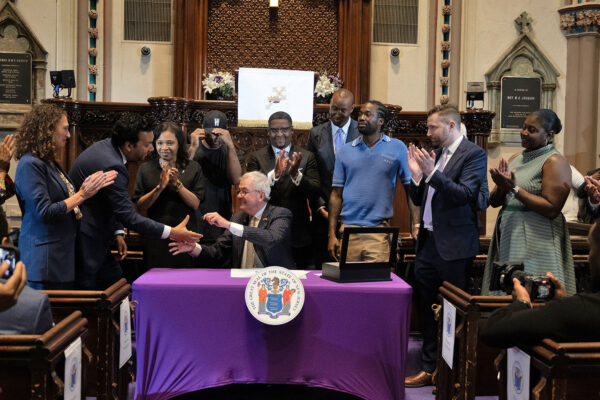 ACLU-NJ Executive Director shakes hands with New Jersey Governor Phil Murphy at the Clemency Executive Order Announcement.