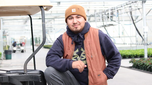 man standing in greenhouse