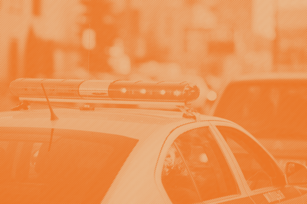 An image of a police car with a orange stripped treatment applied