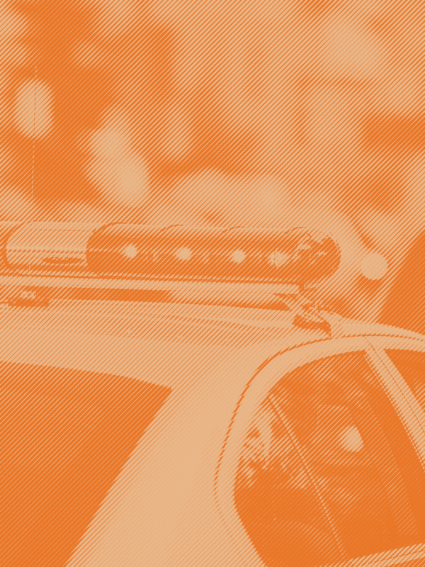 An image of a police car with a orange stripped treatment applied
