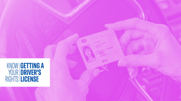 Hands holding a Driver's License