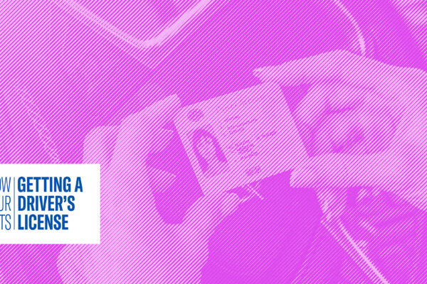 Hands holding a Driver's License