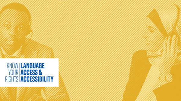 Black cis gendered man speaking with cis female translator next to him