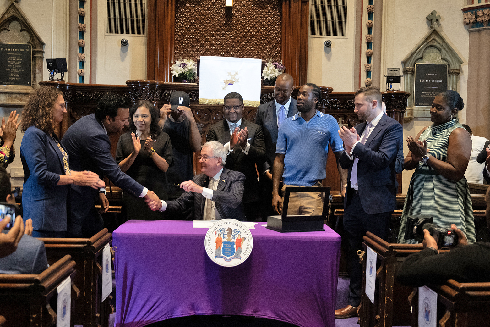 Governor Phil Murphy shaking hands with ACLU-NJ Executive Director Amol Sinha after signing Clemency Executive Order