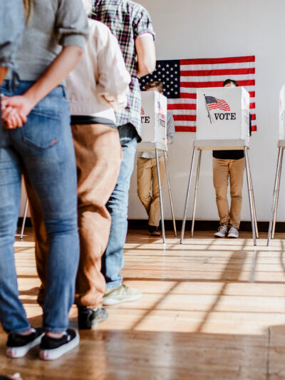 Line of people waiting to vote at a polling location