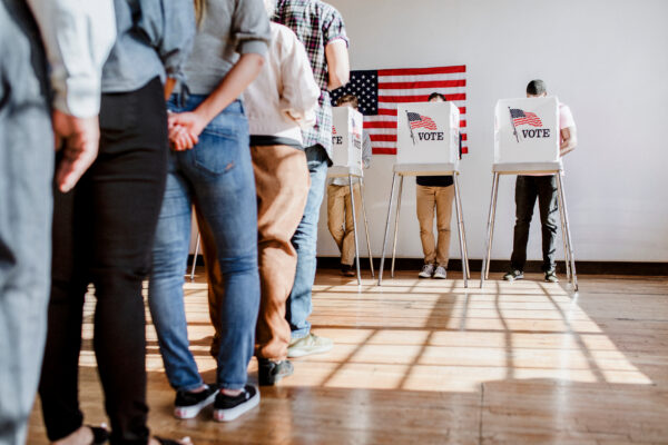 Line of people waiting to vote at a polling location