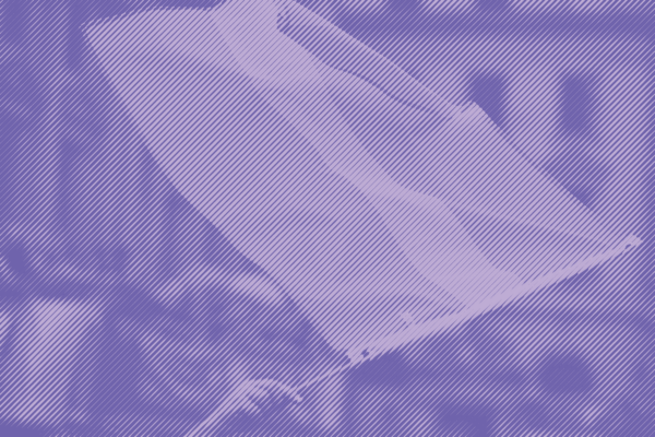 A hand waves a transgender flag in the air with a purple stripped treatment applied.