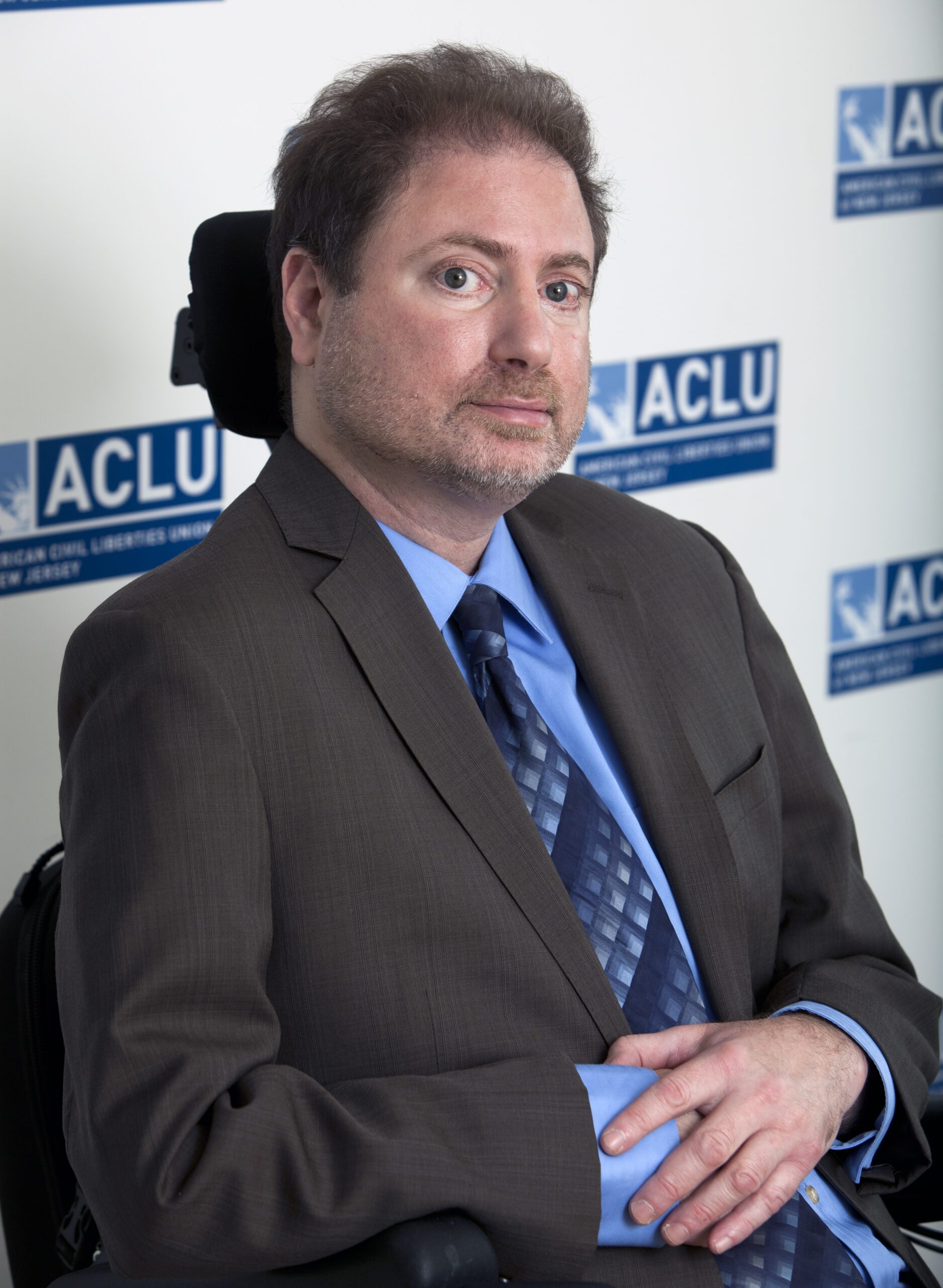 A photo of Ed Barocas with the ACLU-NJ logo in the background.