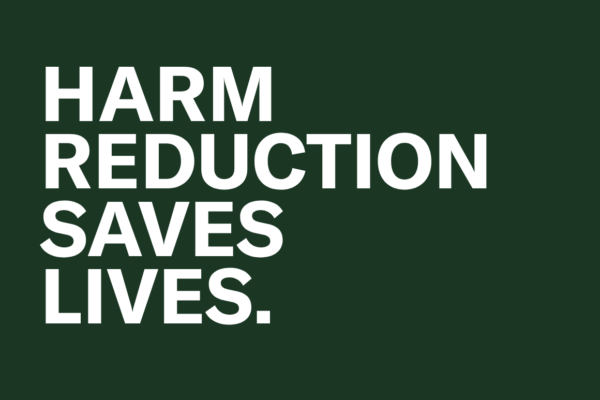 The words "Harm Reduction saves lives" in white text against a dark green background.