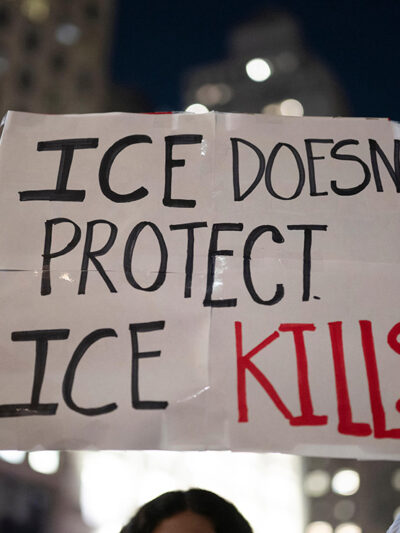 A protest sign that says "ICE Doesn't Protect, ICE Kills."
