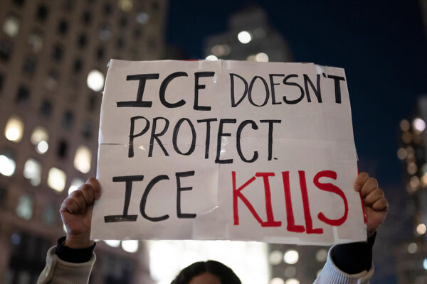 A protest sign that says "ICE Doesn't Protect, ICE Kills."