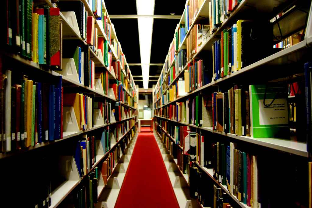 Library shelves in dark lighting 