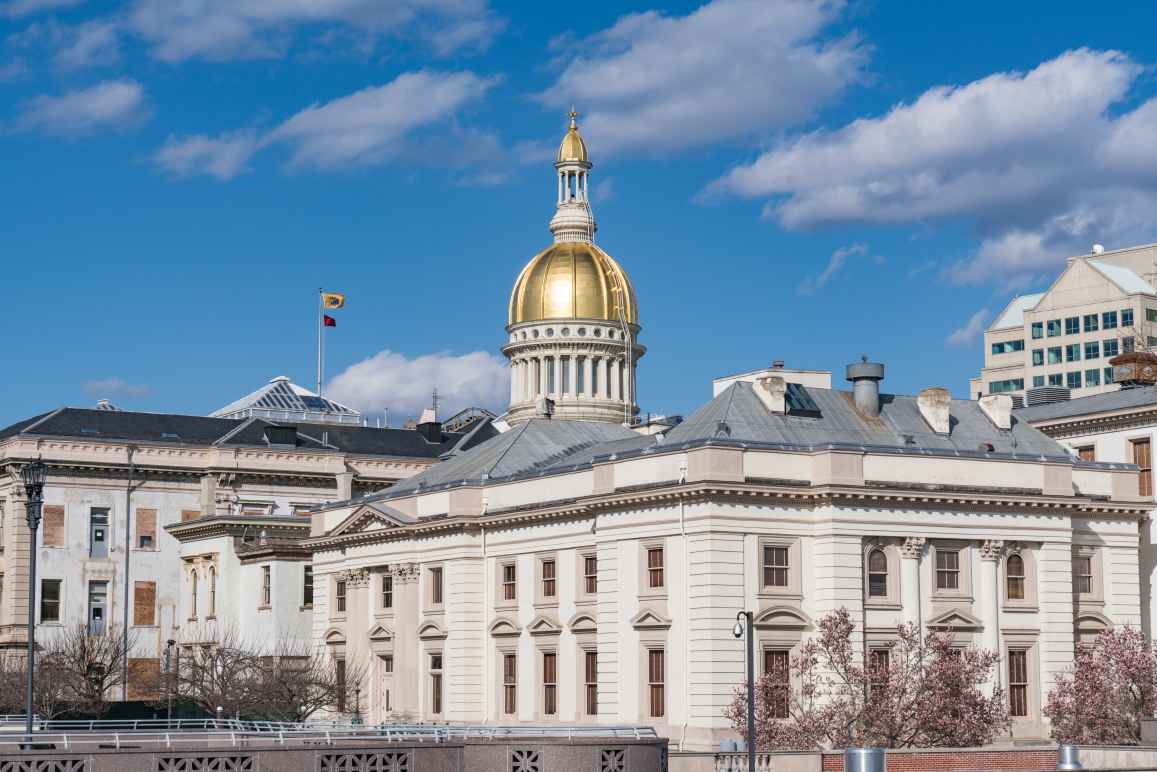 A photo of the New Jersey State House in Trenton on a sunny day.