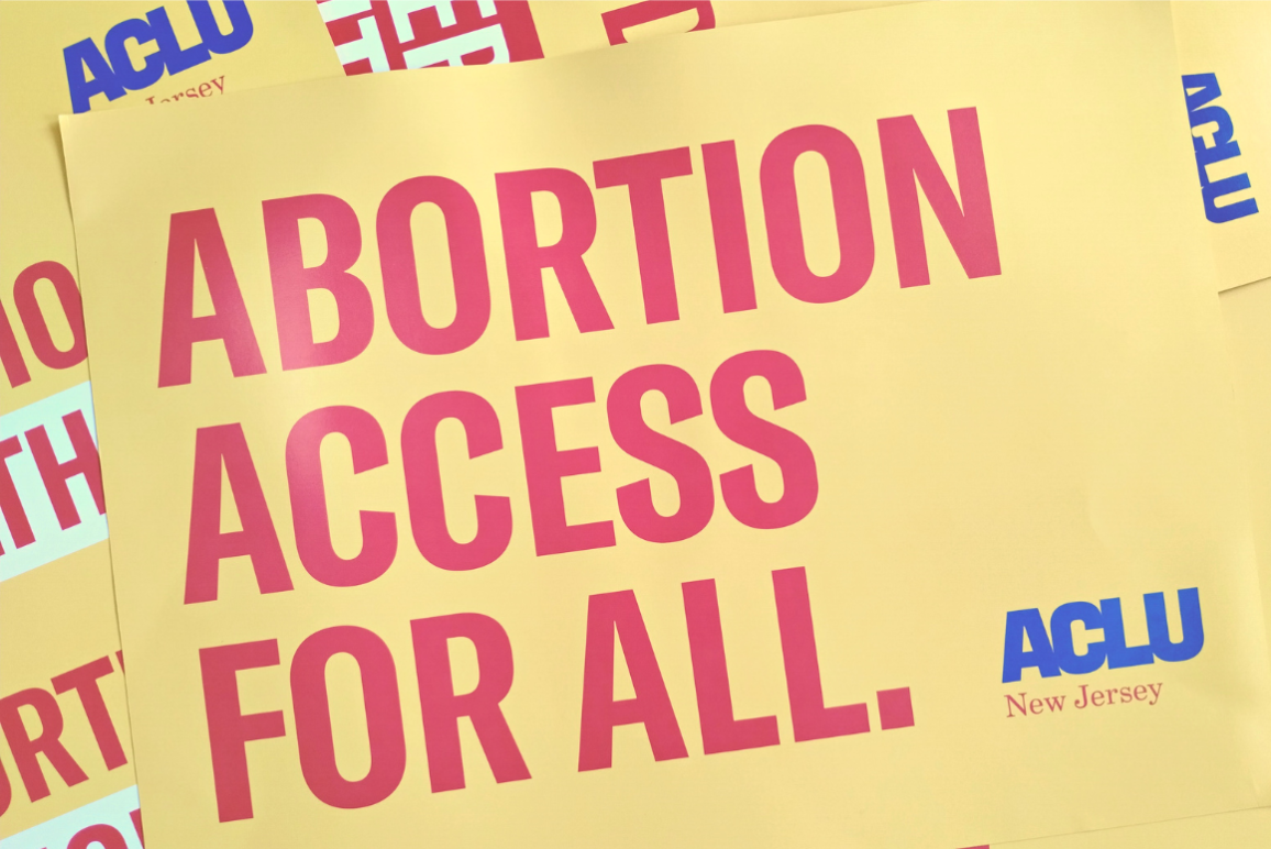 red text on yellow backgrond reading "Abortion Access for All"