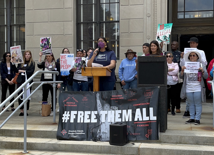 Protestors with a sign "#Freethemall" outside the NJ statehouse 