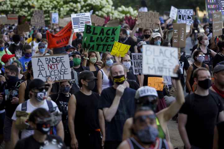 Protesters holding signs 