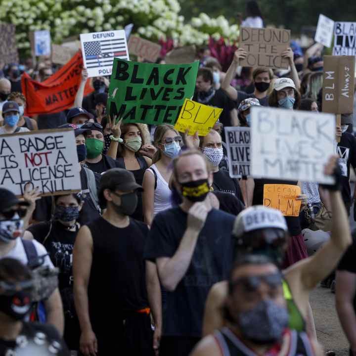 Protesters holding signs 