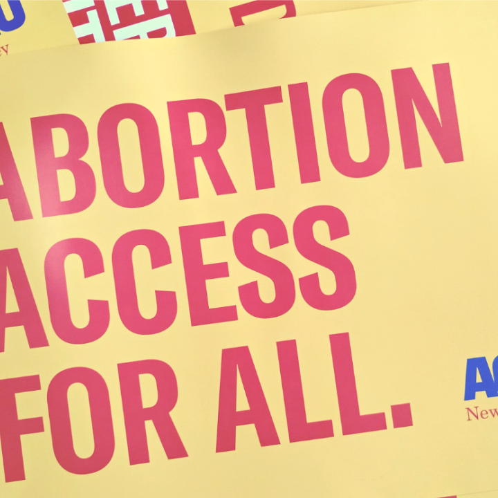 red text on yellow backgrond reading "Abortion Access for All"